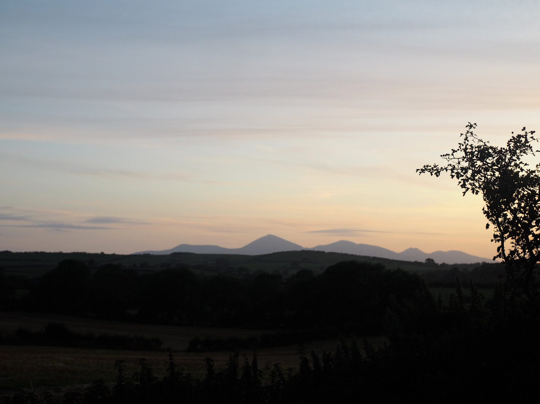 Ballynoe Stone Circle sunset view over the hills