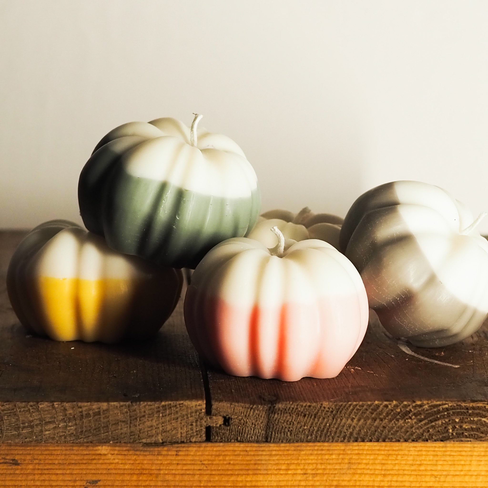 Set of coloured pumpkin candles